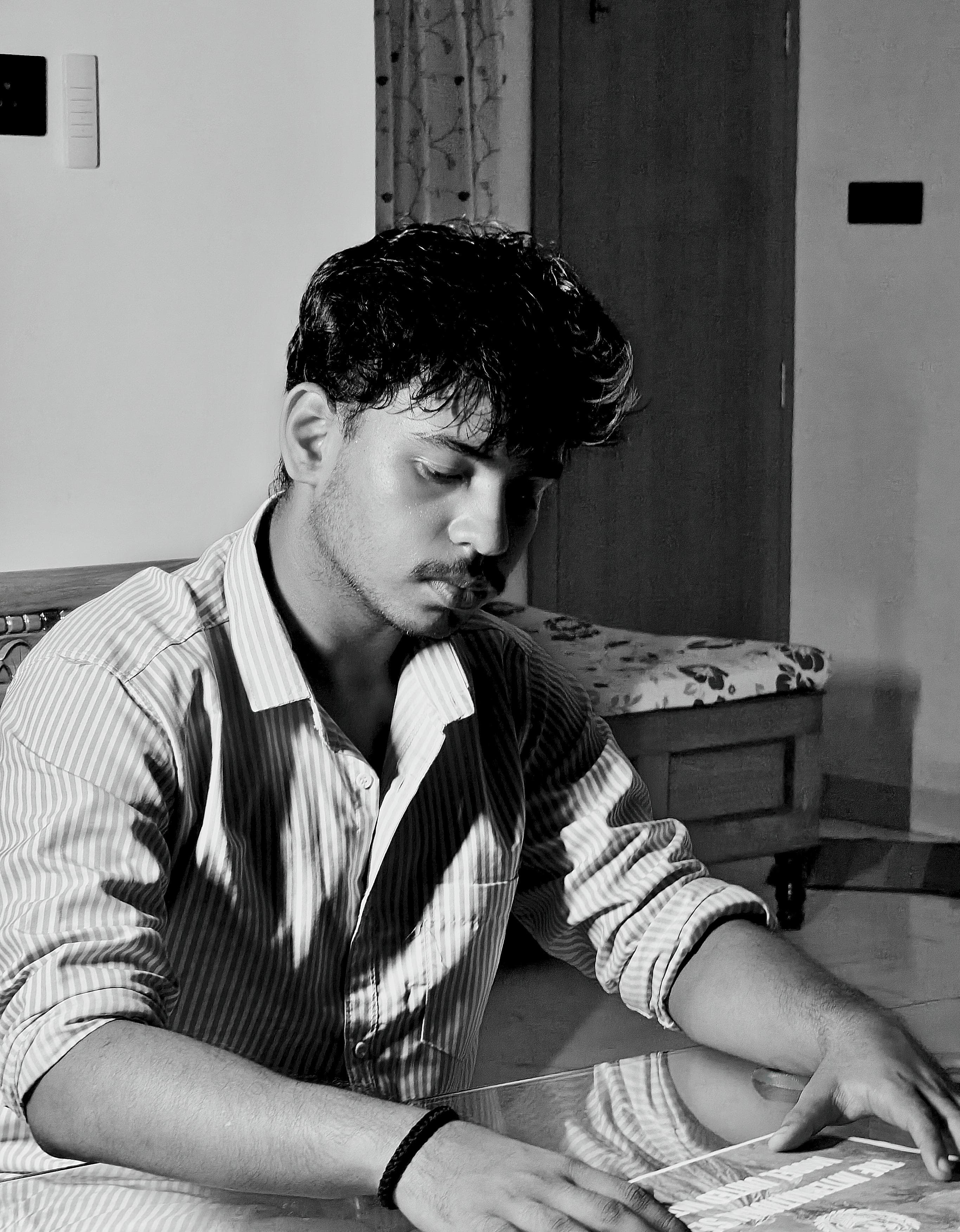 The Founder of TIS MUN, seated at a desk