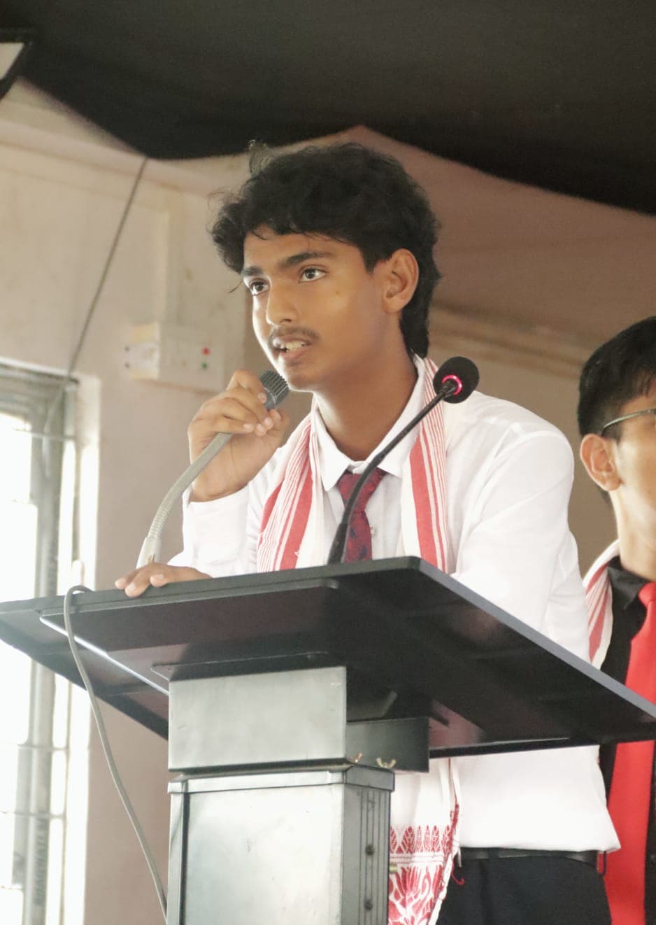 The Secretary-General of TIS MUN speaking at a lectern
